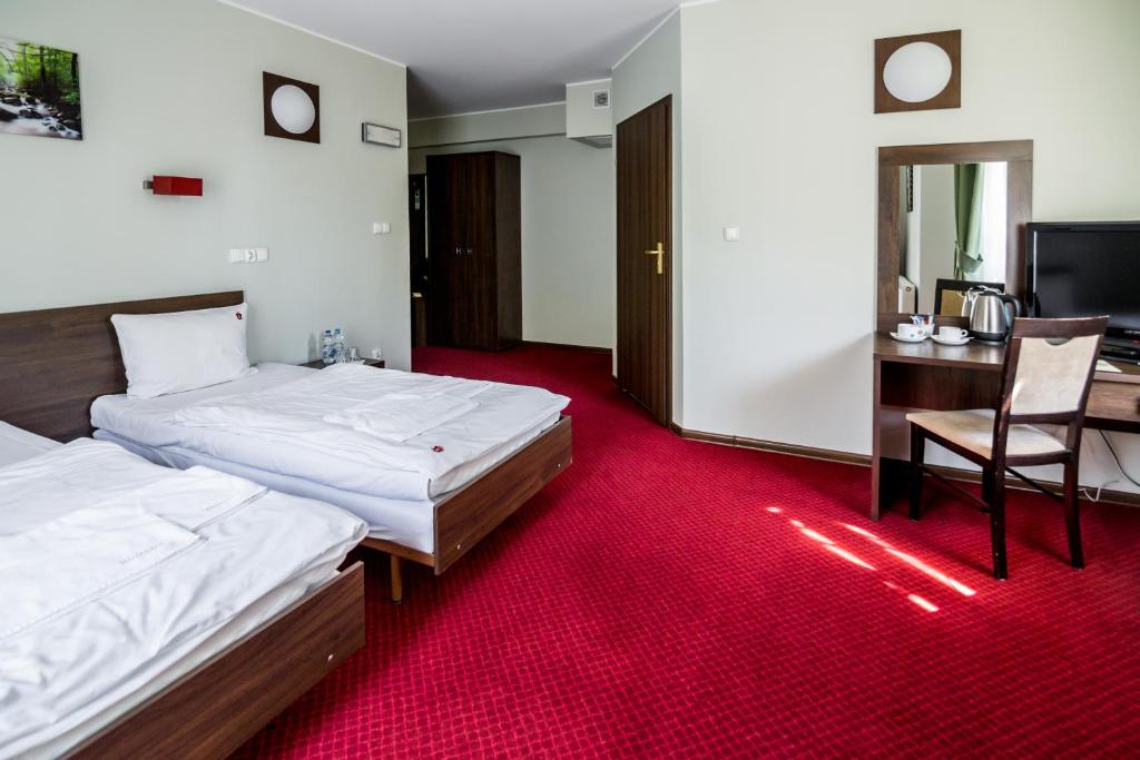 Postel nebo postele na pokoji v ubytování Hotel Walewscy