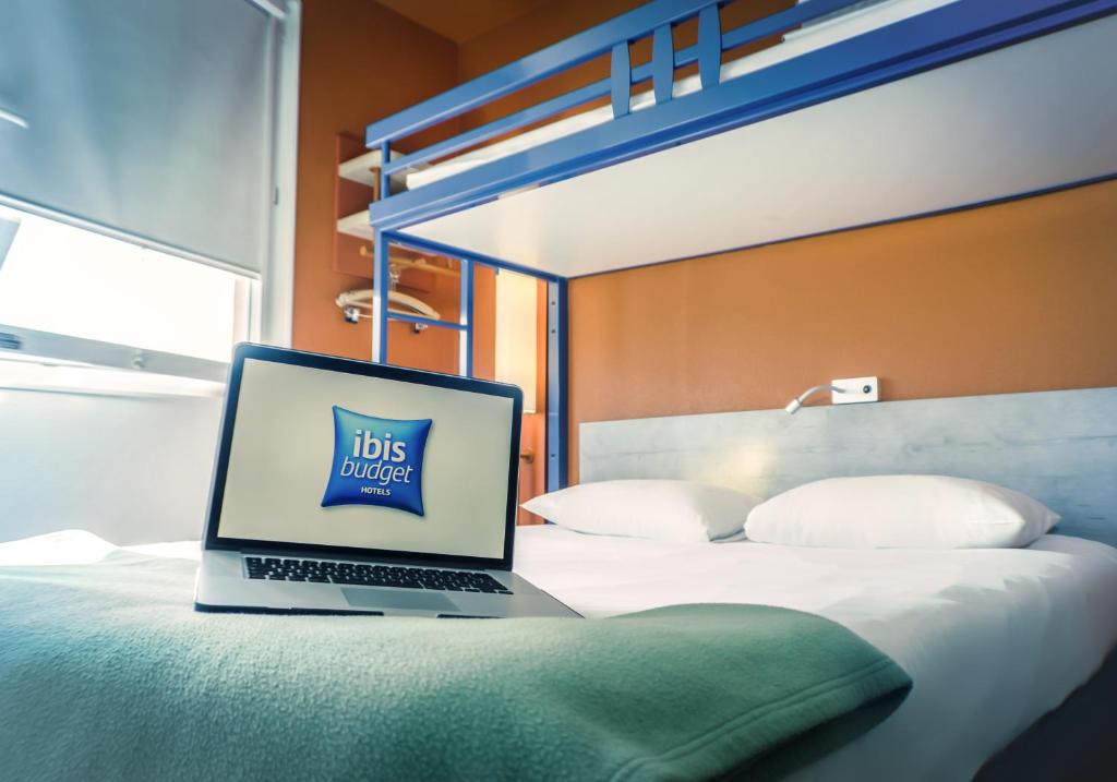 Postel nebo postele na pokoji v ubytování ibis Budget Colmar Centre Gare