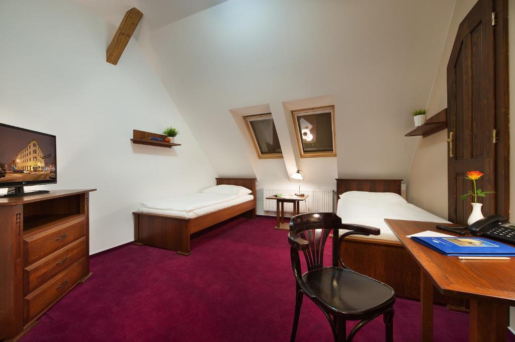 Postel nebo postele na pokoji v ubytování Brioni Boutique Hotel 4*