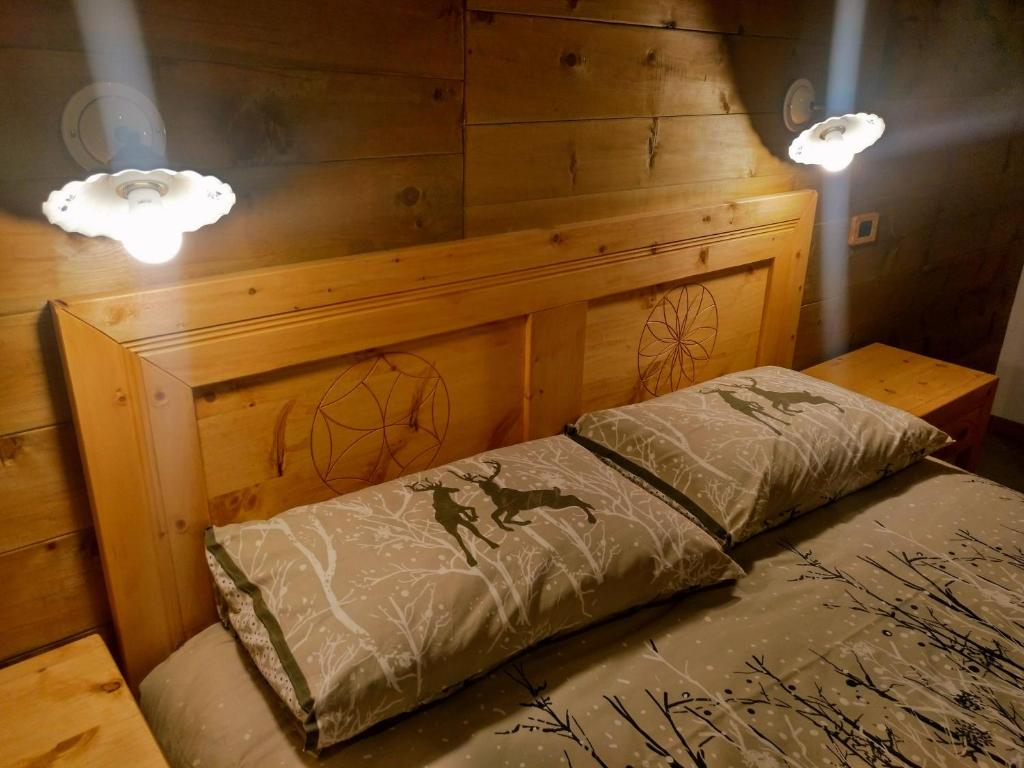 Postel nebo postele na pokoji v ubytování Delfin Dal Pianhol