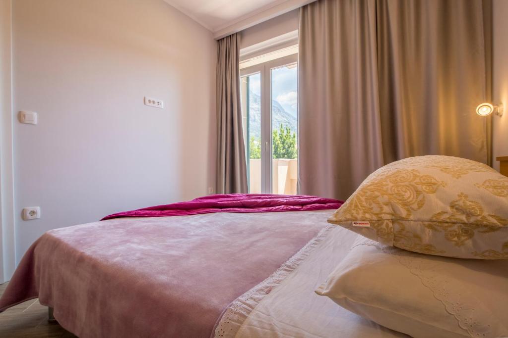 Posteľ alebo postele v izbe v ubytovaní Apartments Smokva