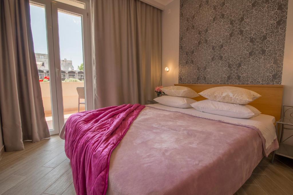 Posteľ alebo postele v izbe v ubytovaní Apartments Smokva