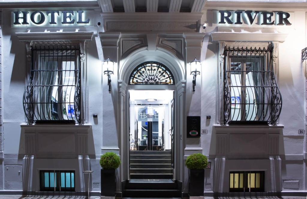 a building with two entrances to a hotel at LHP Hotel River & SPA in Florence