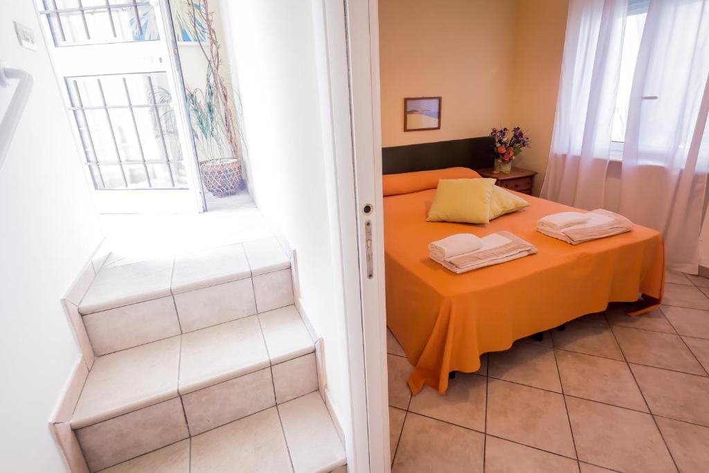 Postel nebo postele na pokoji v ubytování Mandarinoarancio