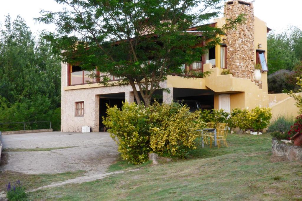 an external view of a villa with a building at Terrazas al Champaqui in Villa Yacanto