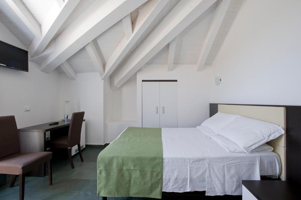 Postel nebo postele na pokoji v ubytování Dipendenza Hotel Bellavista