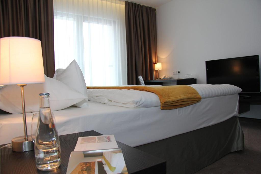 Postel nebo postele na pokoji v ubytování Hotel Mousson