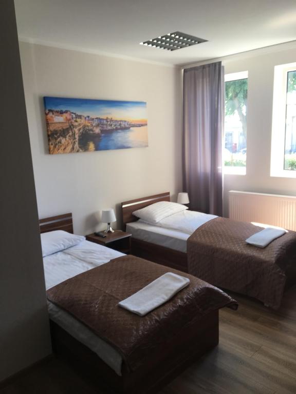 Postel nebo postele na pokoji v ubytování M&A GUEST ROOMS