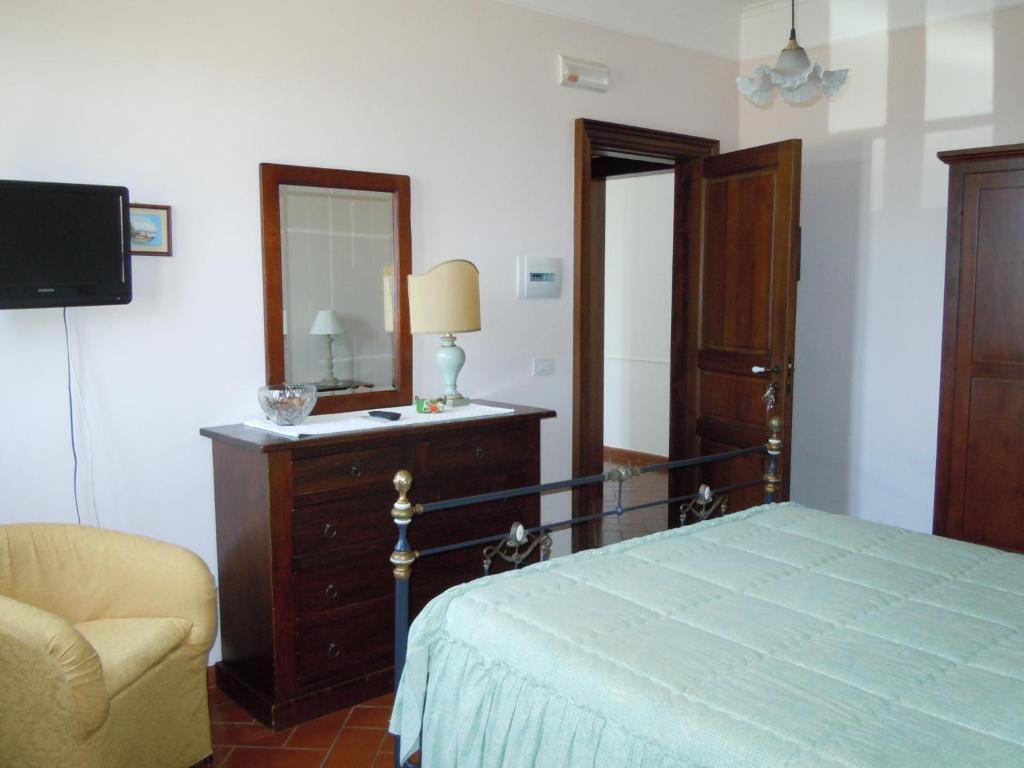Postel nebo postele na pokoji v ubytování Agriturismo Le Carolee