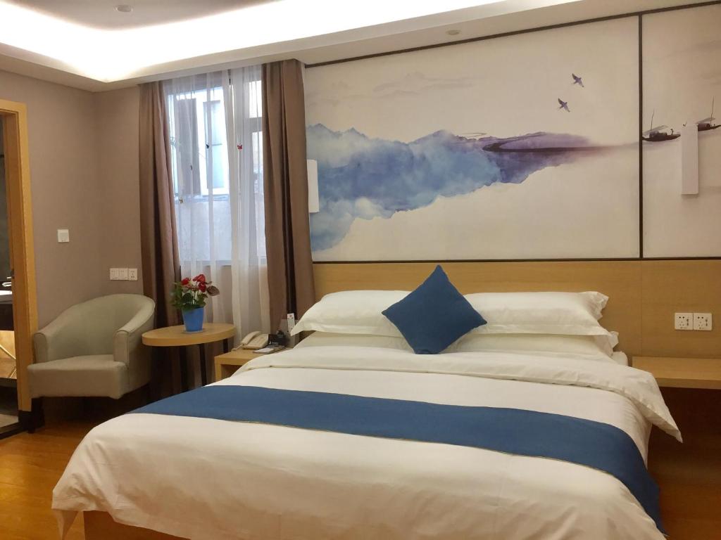 Postel nebo postele na pokoji v ubytování Guangzhou Hongcheng Hotel