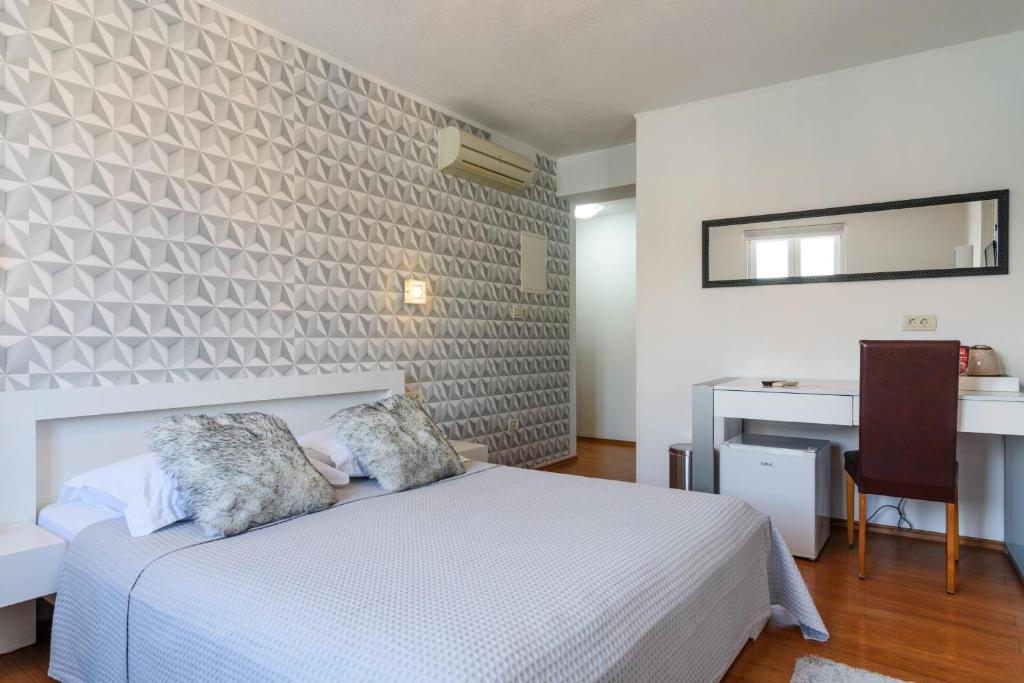 Postel nebo postele na pokoji v ubytování Villa Jidro