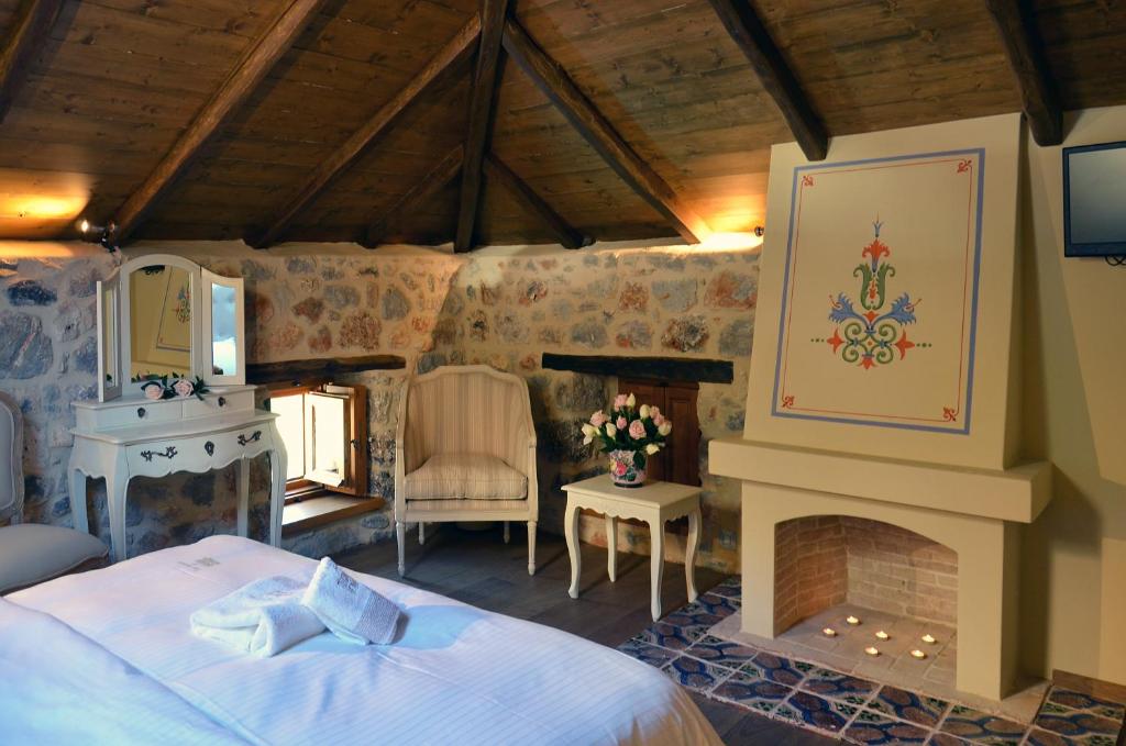Postel nebo postele na pokoji v ubytování Archontiko Chioti