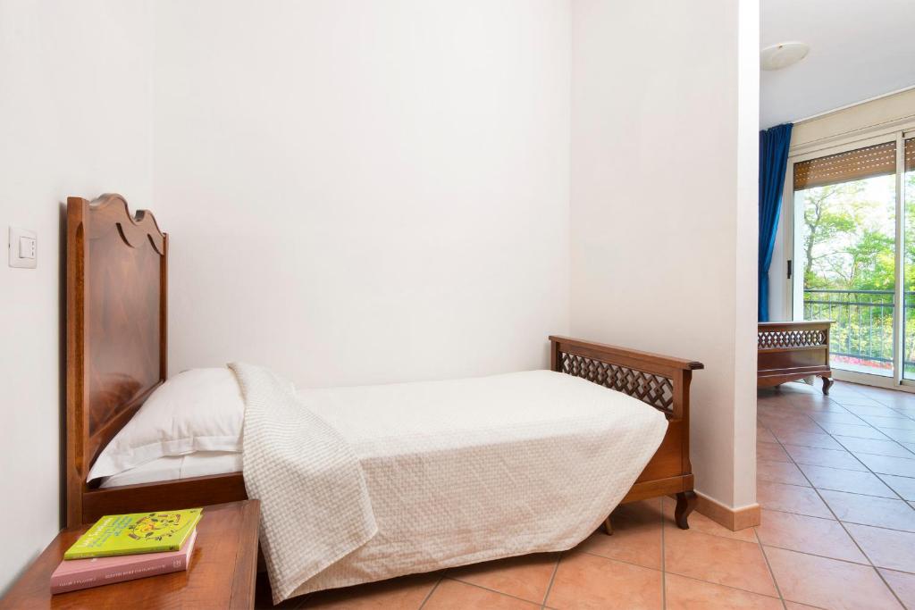 Postel nebo postele na pokoji v ubytování Agriturismo Al Motto
