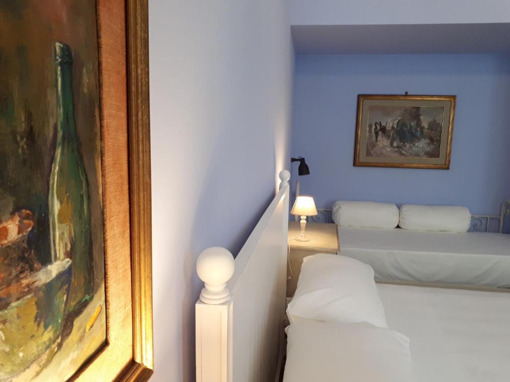 Postel nebo postele na pokoji v ubytování Sofia Family Suites