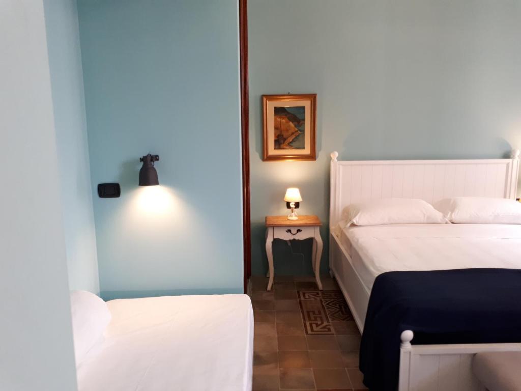 Postel nebo postele na pokoji v ubytování Sofia Family Suites