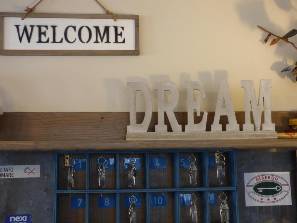a sign that reads welcome to thezona dugout at Hotel Turandot in Torre del Lago Puccini