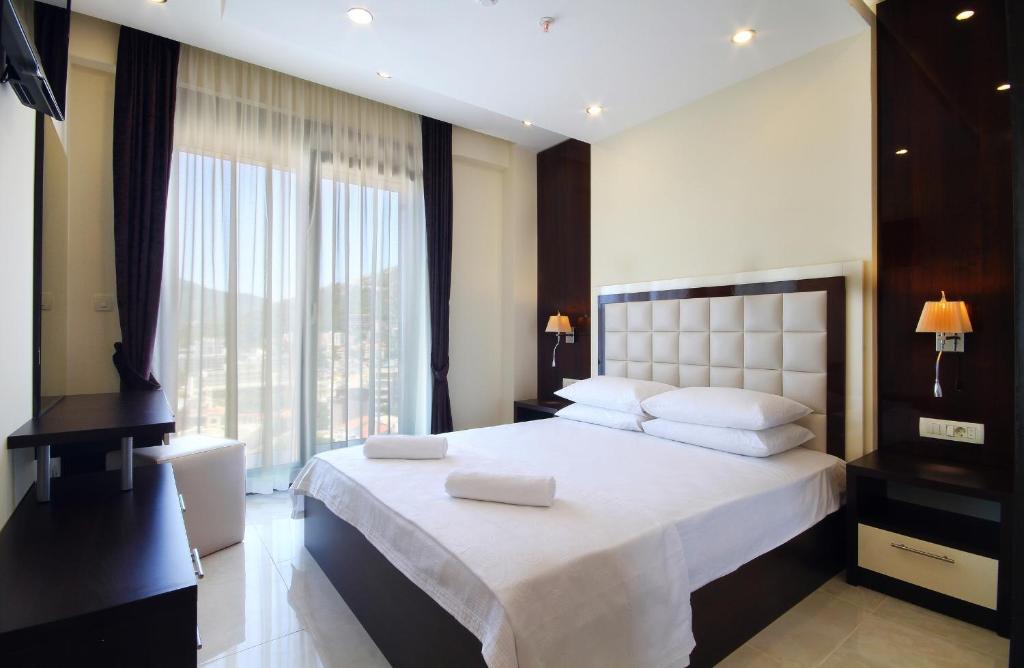 Postel nebo postele na pokoji v ubytování Shine residence