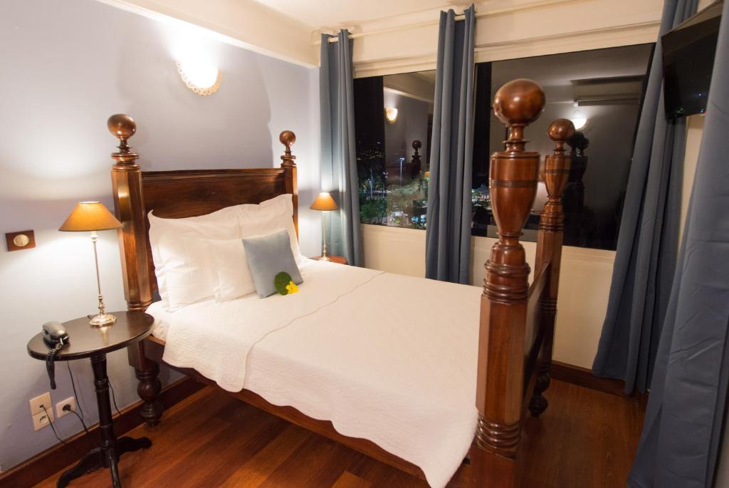 Postel nebo postele na pokoji v ubytování Hotel l'Impératrice