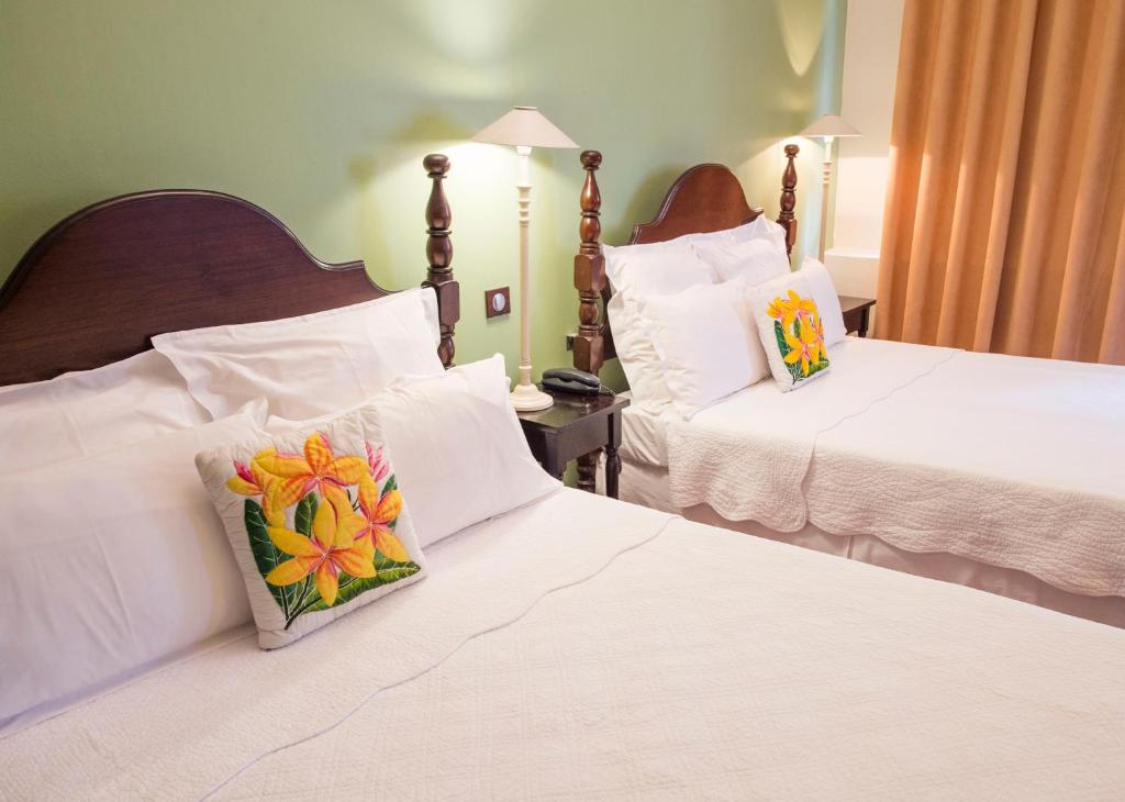 Postel nebo postele na pokoji v ubytování Hotel l'Impératrice