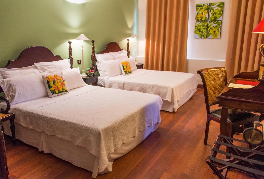 Postel nebo postele na pokoji v ubytování Hotel l'Impératrice