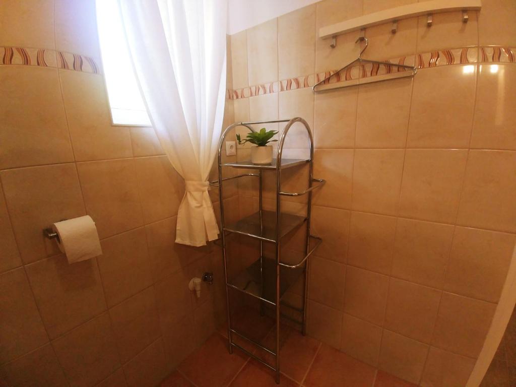 Koupelna v ubytování Sarok Apartmanház