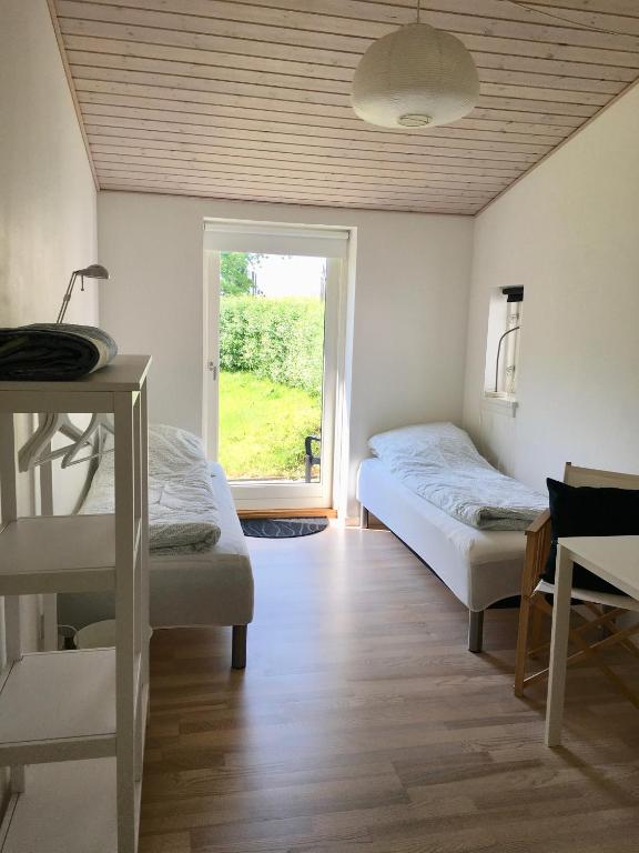Postel nebo postele na pokoji v ubytování Tusindfrugt B&B