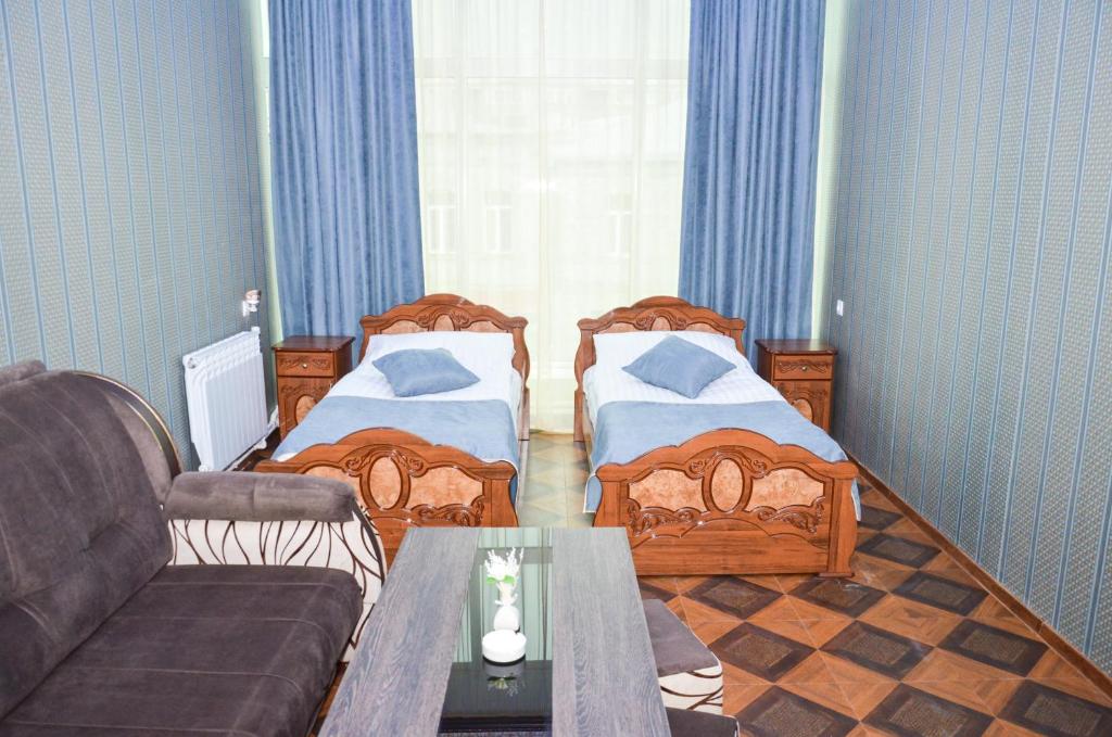 Postel nebo postele na pokoji v ubytování Zangezur Hotel