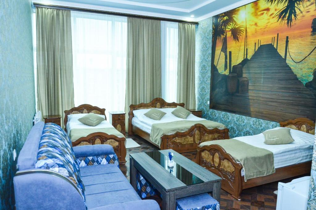 Postel nebo postele na pokoji v ubytování Zangezur Hotel