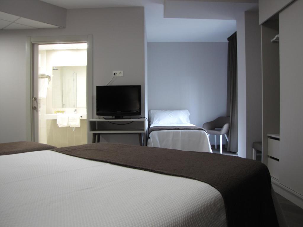 TV a/nebo společenská místnost v ubytování Hotel Ton