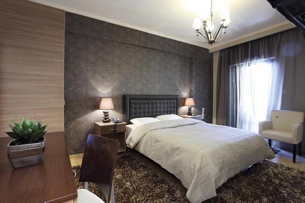 Postel nebo postele na pokoji v ubytování Delfini Hotel