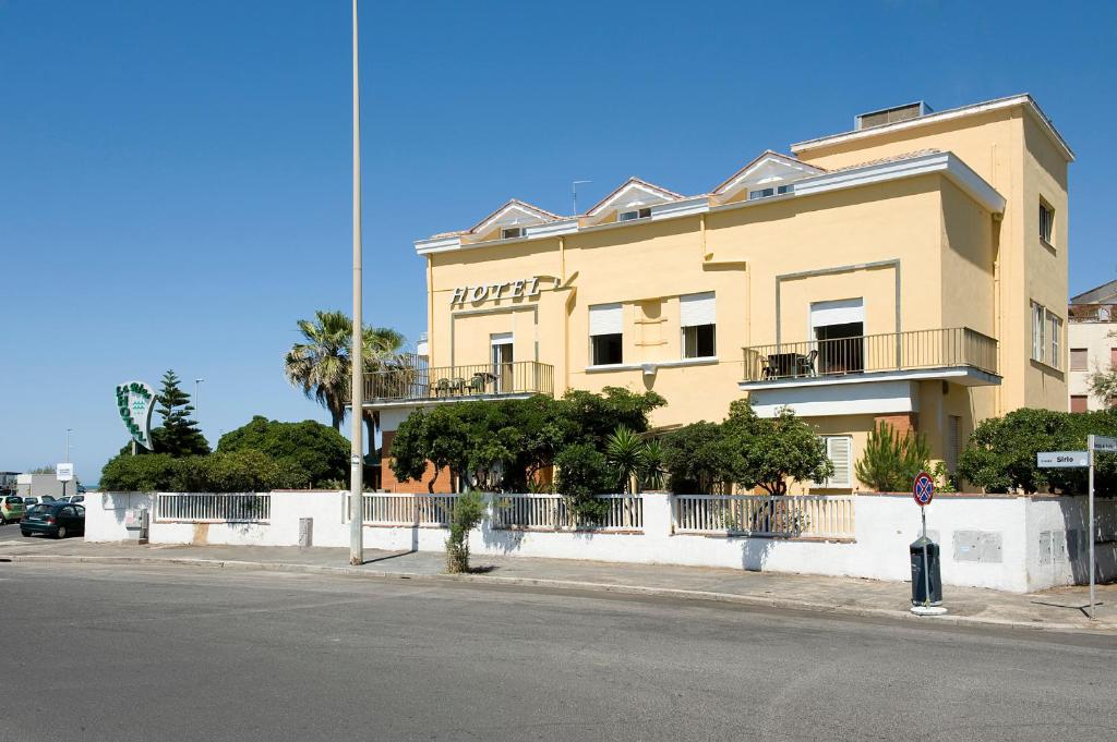 a large building on the side of a street at Dipendenza Hotel Bellavista in Lido di Ostia