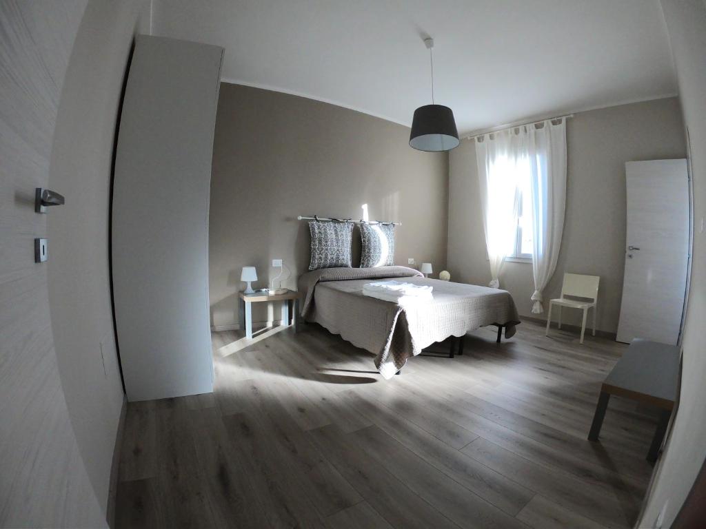 Postel nebo postele na pokoji v ubytování Stanza privata La Conquilla