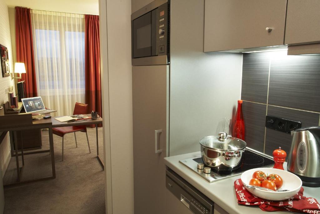Kuchyň nebo kuchyňský kout v ubytování Aparthotel Adagio Vienna City