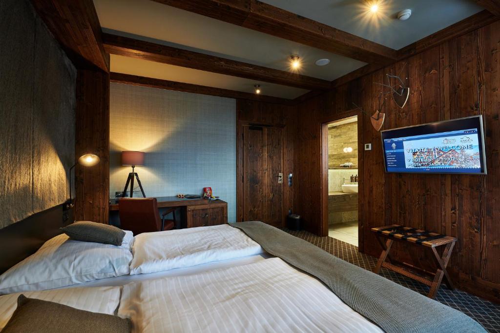 Postel nebo postele na pokoji v ubytování Hotel Pošta