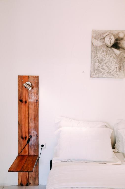 Tempat tidur dalam kamar di Pojok Pas