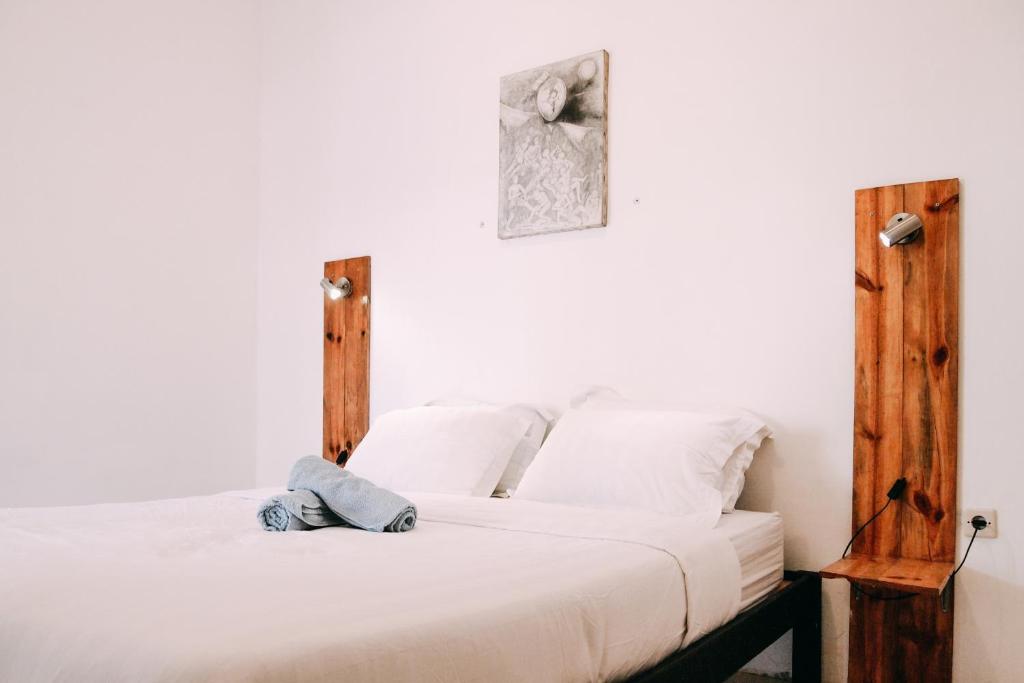Tempat tidur dalam kamar di Pojok Pas