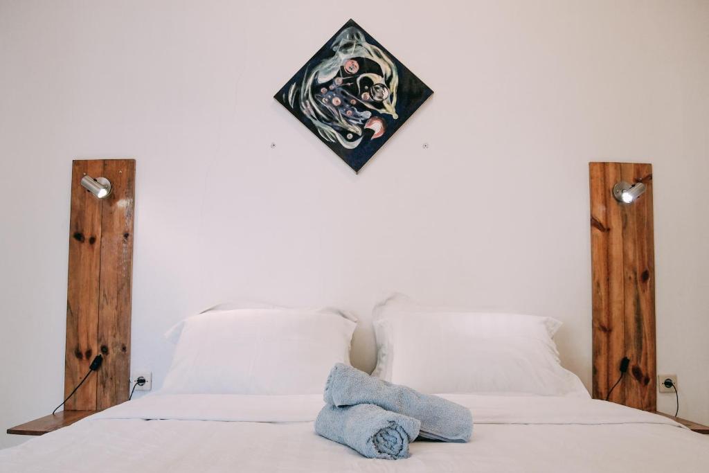 Tempat tidur dalam kamar di Pojok Pas
