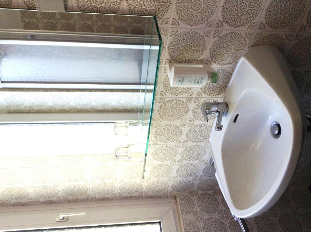 Koupelna v ubytování Hotel Garni