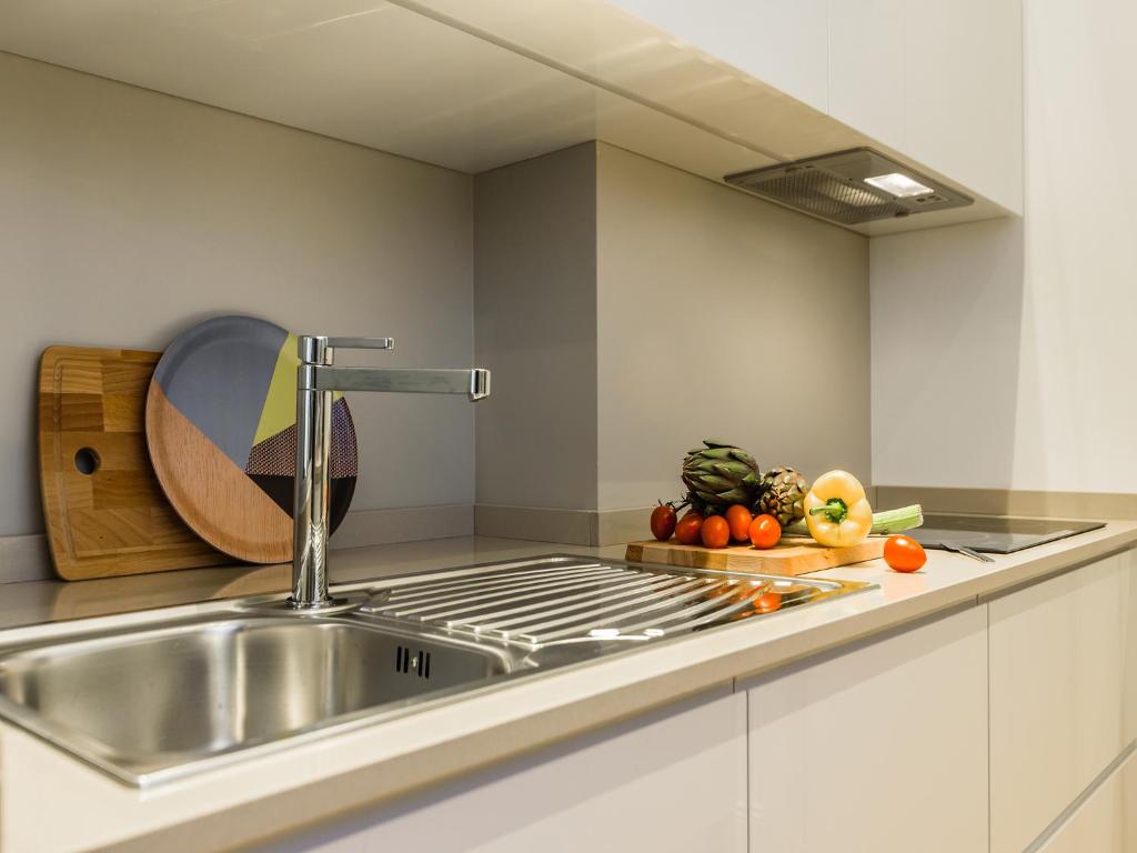 Kuchyňa alebo kuchynka v ubytovaní Milano Manzoni CLC Apartments