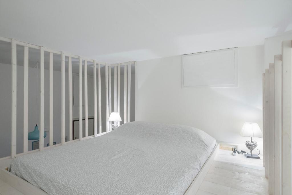 Posteľ alebo postele v izbe v ubytovaní New loft in the heart of Bologna 2