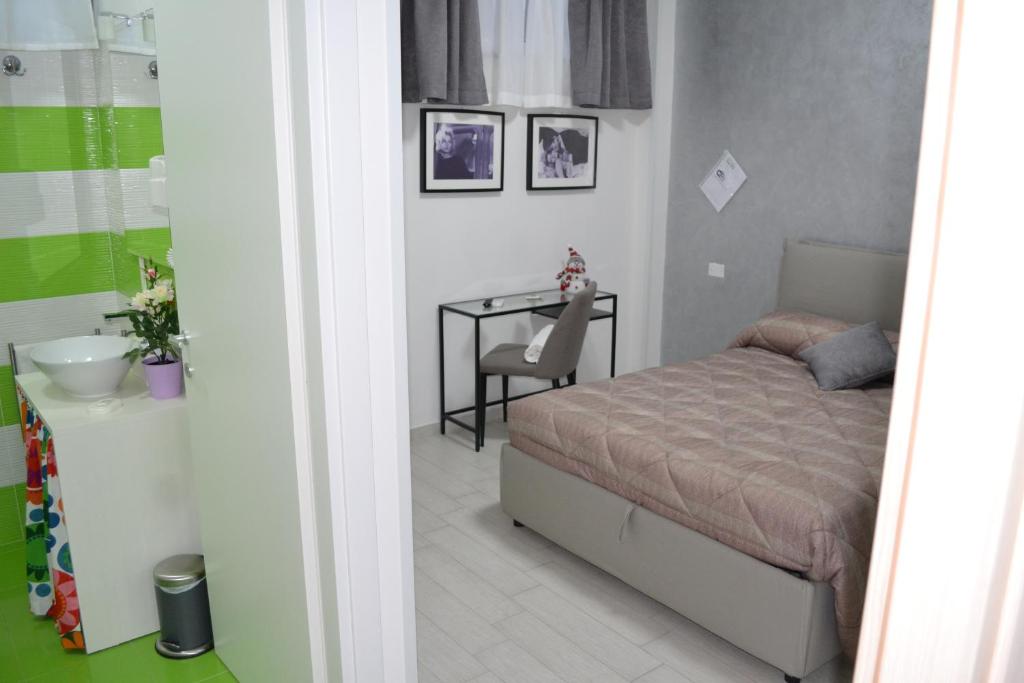 A bed or beds in a room at TIBUR STAR Guest House