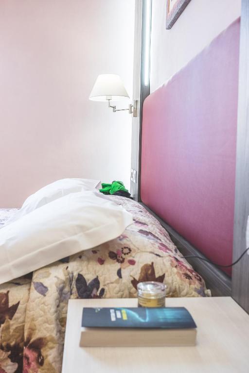 Posteľ alebo postele v izbe v ubytovaní Hotel Il Giardino