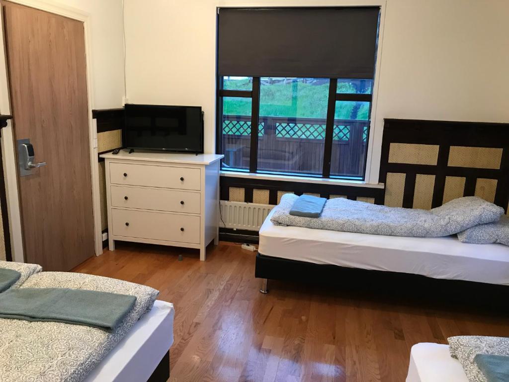 Postel nebo postele na pokoji v ubytování Lava Guesthouse