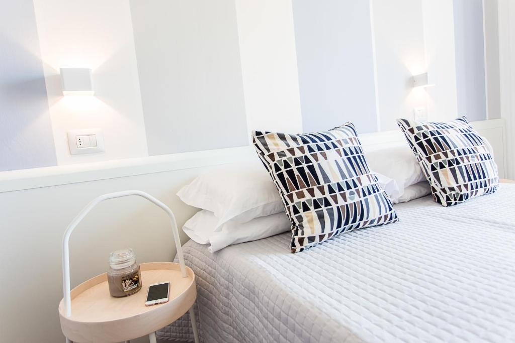Postel nebo postele na pokoji v ubytování Hotel Geminus B&B