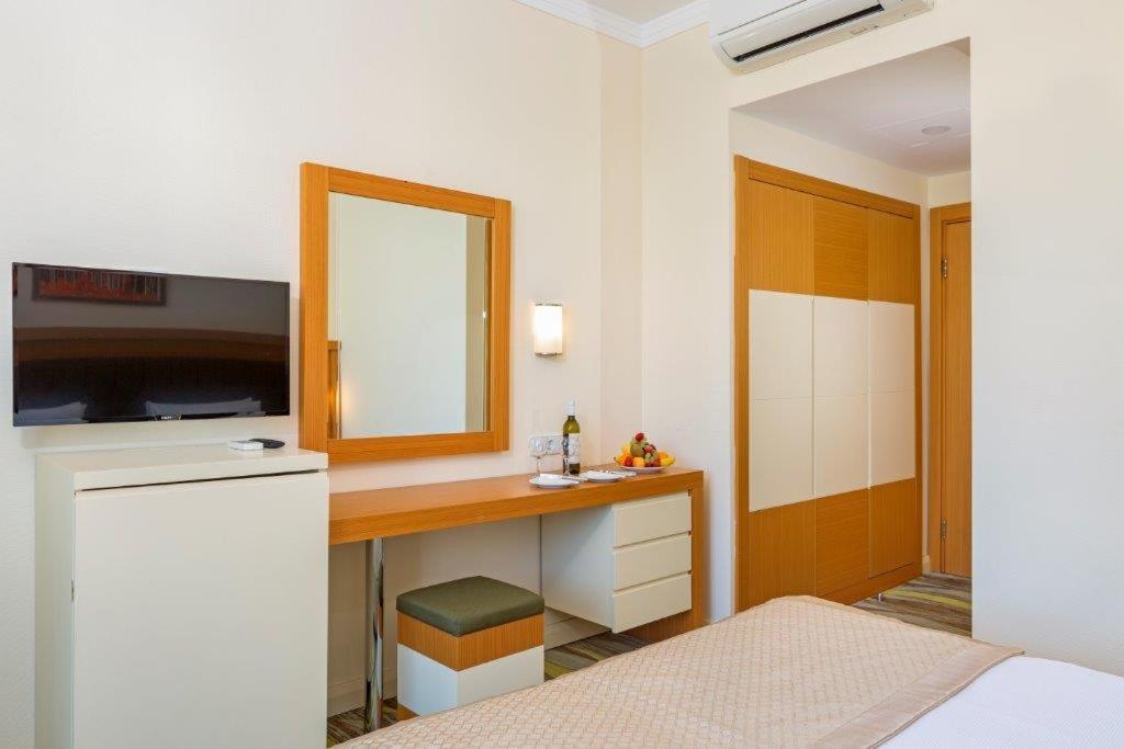 Postel nebo postele na pokoji v ubytování Forest Park Hotel