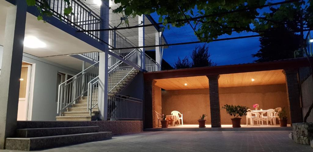 a staircase leading up to a house at night at White House in Kakheti Eniseli in Gremi