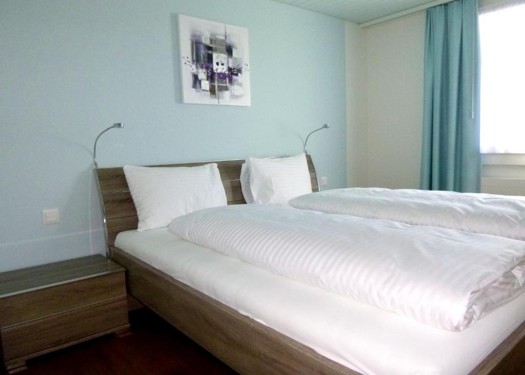 Postel nebo postele na pokoji v ubytování Hotel Metzgern