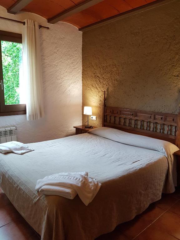 Postel nebo postele na pokoji v ubytování Apartaments Can Bundanci