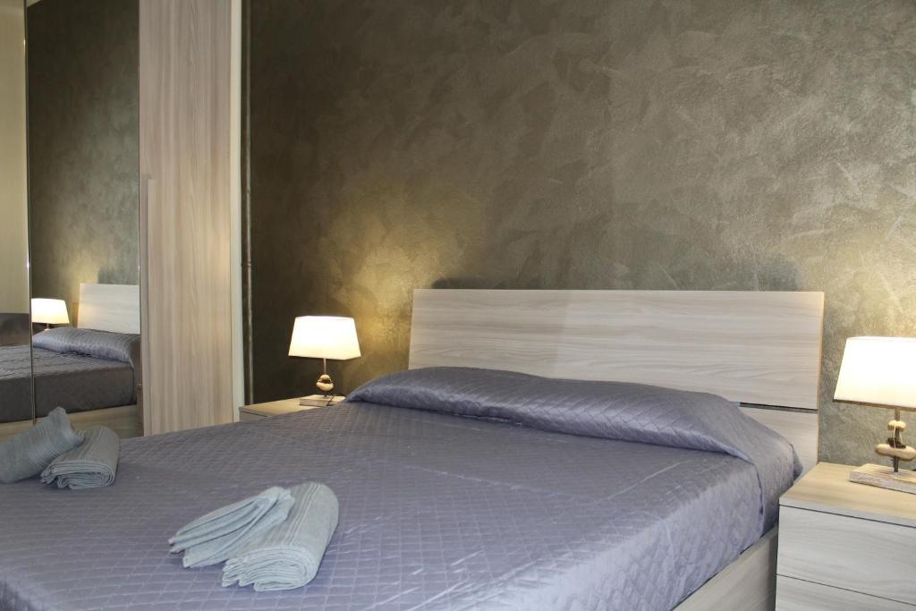A bed or beds in a room at Cagliari 4u