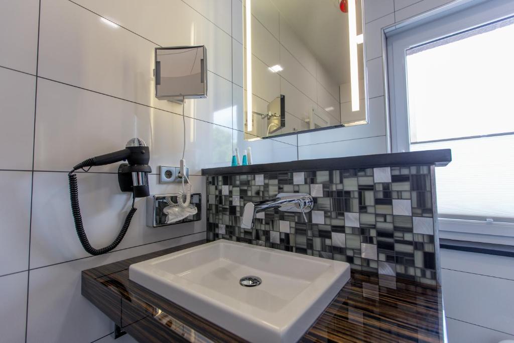 Koupelna v ubytování Aragon - Hotel - Garni